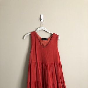 Rust colored flowy dress.